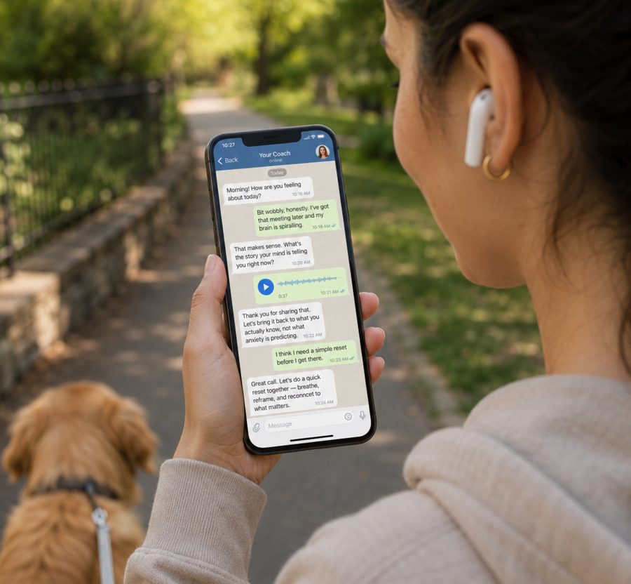 Someone out walking a dog, holding a phone with a Telegram conversation on the screen